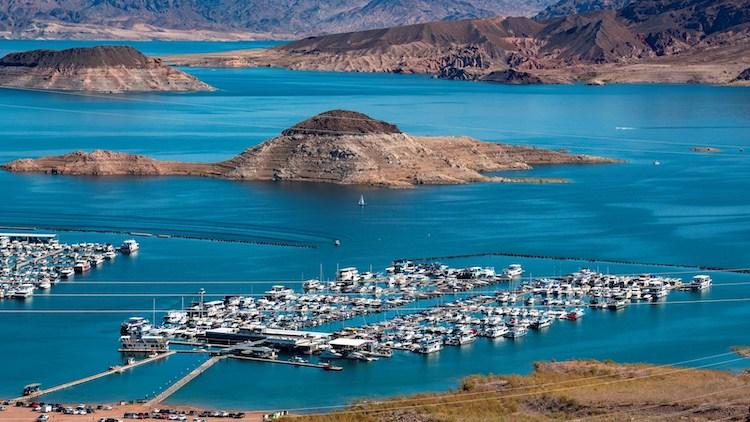 A photo of Lake Las Vegas, with boats moored on docks.